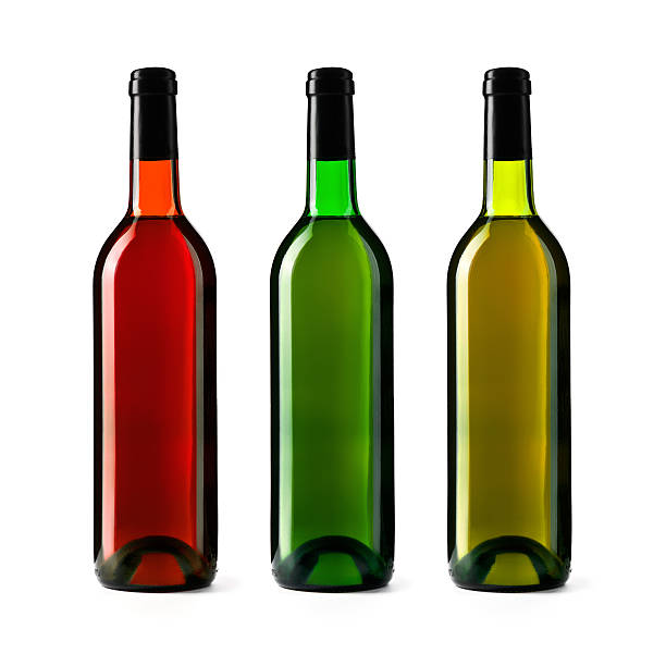 Three Wine Bottles with rose wine, dry white wine, sweet white wine, isolated on white background, studio shot.