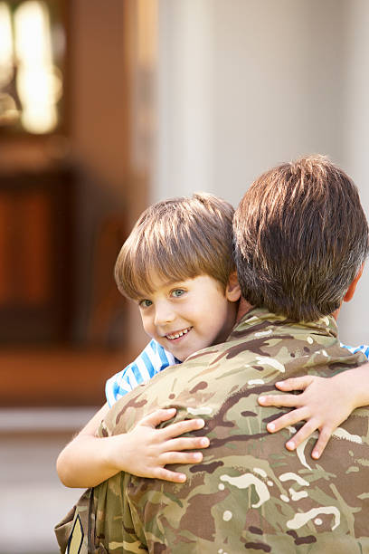 istock Soldier Returning Home And Greeted By Son 171262880