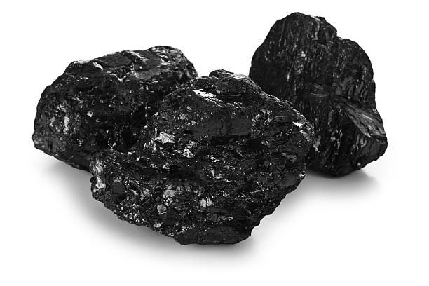 istock Three pieces of black coal in contrast with white background 171263086
