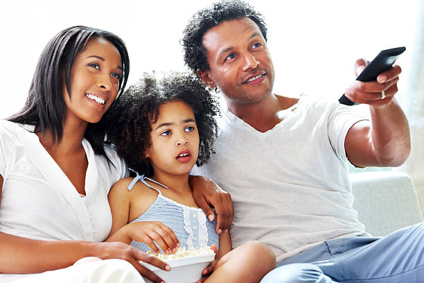 istock Afro-American family watching television at home 171263243