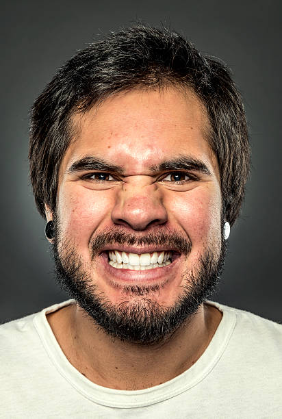 An excited young adult looking at camera.