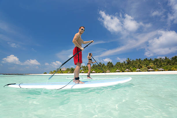 istock people stand up paddling lagoon 171263844