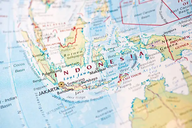 Photo map of Indonesia. Shallow depth of field, focus on the Jakarta city of the map and the area nears it.