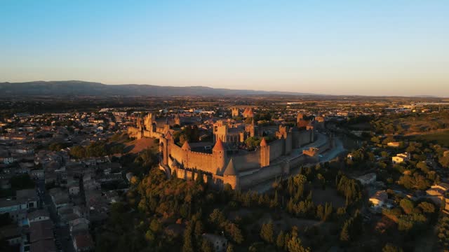 Slow rising aerial shot of the Medieval citadel Carcassonne during sunset