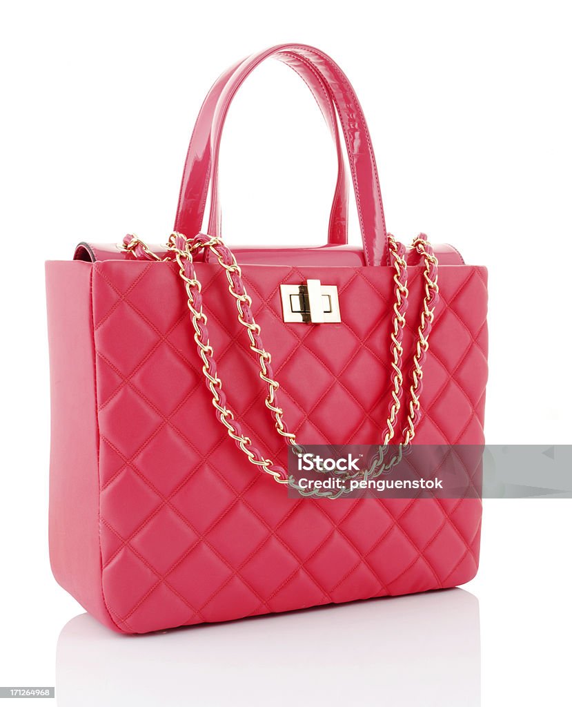 A pink leather bag with gold chains pink bag Purse Stock Photo