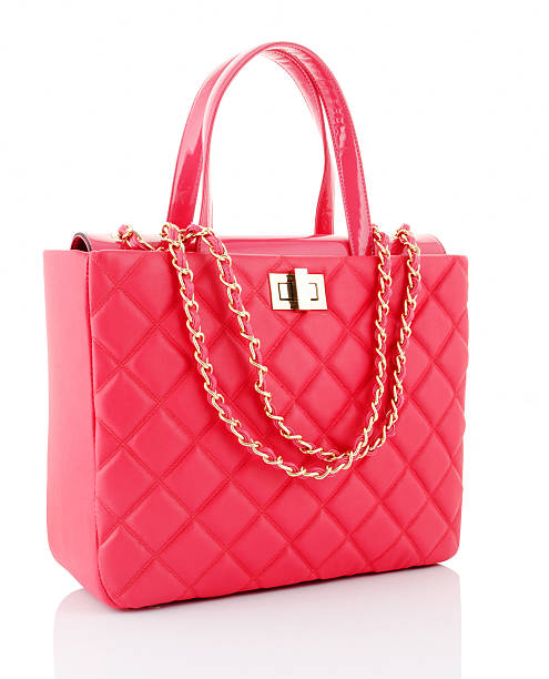 A pink leather bag with gold chains pink bag handbag stock pictures, royalty-free photos & images