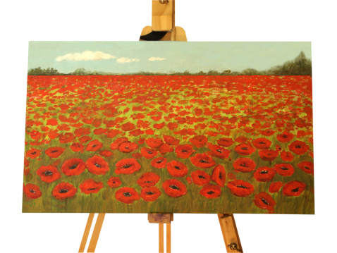 Poppy field painting on easel on white background. The painting is my art product and I am the owner of the copyright.