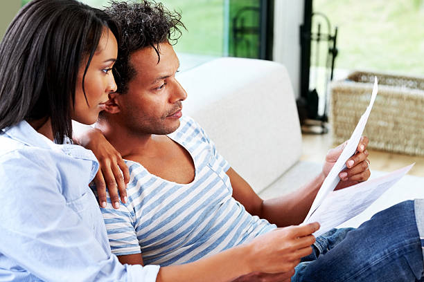 istock Couple reviewing documents at home 171266933