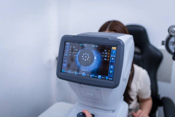 istock Woman optical shop customer doing eyesight measurement with optical phoropter check eye distance for eyeglasses is optical eye shop service. 1712669485
