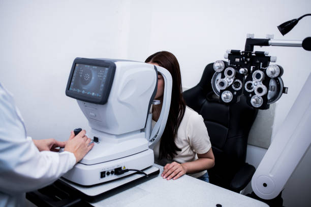 istock Woman optical shop customer doing eyesight measurement with optical phoropter check eye distance for eyeglasses is optical eye shop service. 1712669488