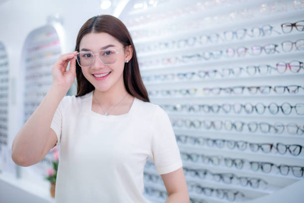 istock Woman optical shop customer doing eyesight measurement with optical phoropter check eye distance for eyeglasses is optical eye shop service. 1712671210