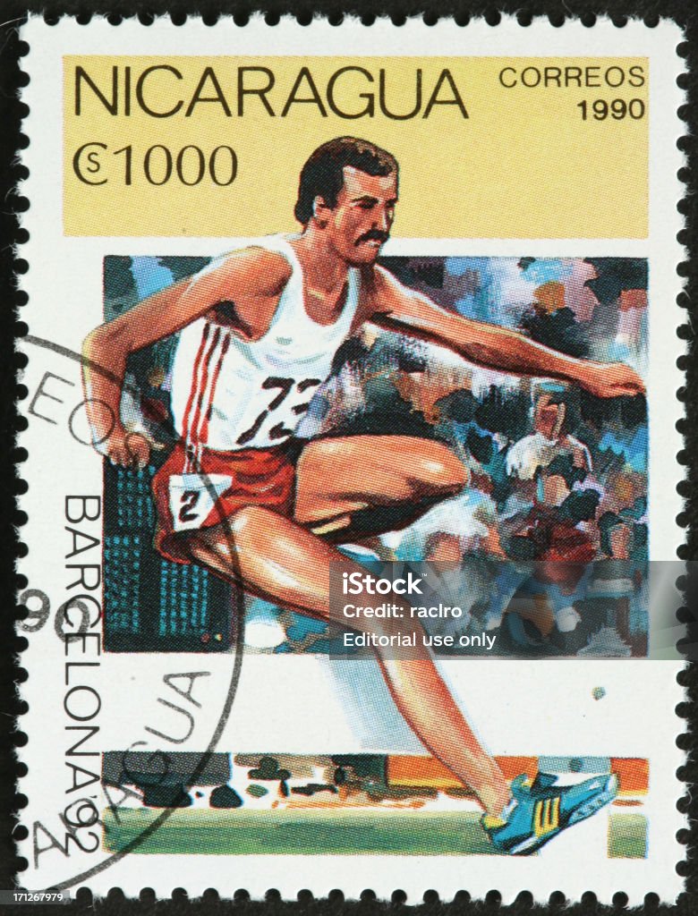 Olympic hurdler, Barcelona 1992 Games "Boulder, USA - May 6, 2012:Nicaraguan postage stamp commemorating the 1992 Barcelona Summer Olympic Games.  This stamp shows a male hurdler in mid jump." Postage Stamp Stock Photo