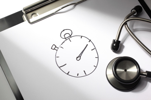 Healthcare concept. Stopwatch drawn on a doctor's clipboard with stethoscope.