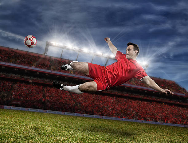 istock Soccer player kicking ball in midair 171268950