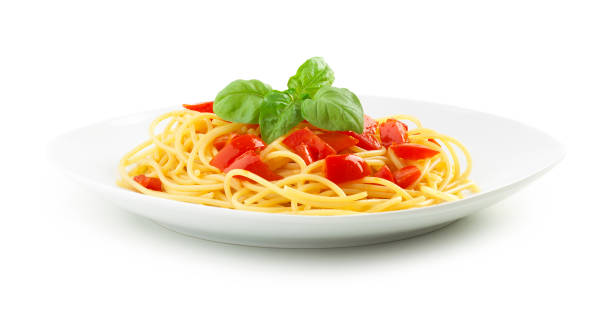 Plate full of spaghetti pasta with tomatoes stock photo