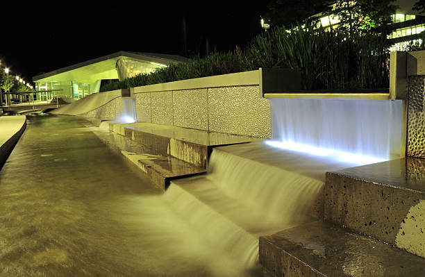 Gerald D. Hines Waterwall Park with skyscrapers in the background, Houston, Texas.