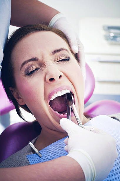 istock Dental Patient Having Tooth Extracted with Pliers 171269164