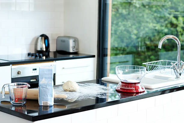 Domestic kitchen during bread preparation Image of a domestic kitchen during bread preparation flour mess stock pictures, royalty-free photos & images