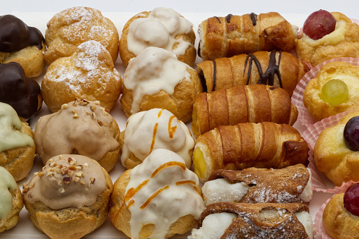 Tray of small delicious Italian pastries. Mignon high pastry Italian style. Typical Italian dessert. Close-up