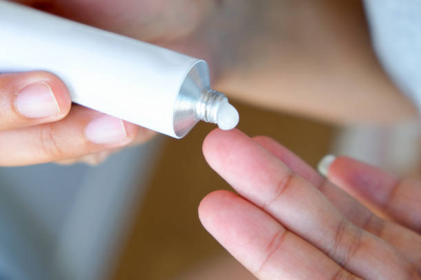 istock The woman's hand, she uses steroids Apply External type 1712695579