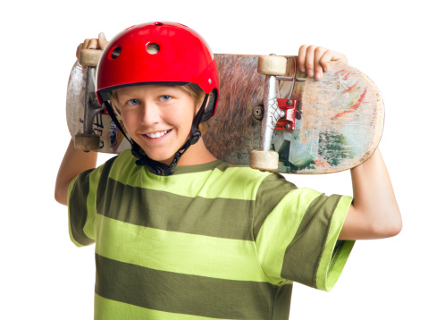 This is a photo of a 14 year old boy holding a skateboard taken in the studio on a white background.Click on the links below to view lightboxes.