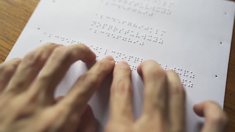 Blind person reading book