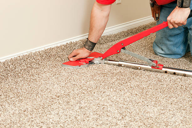 istock Installer Using Carpet Stretcher on New Bedroom Floor 171270824