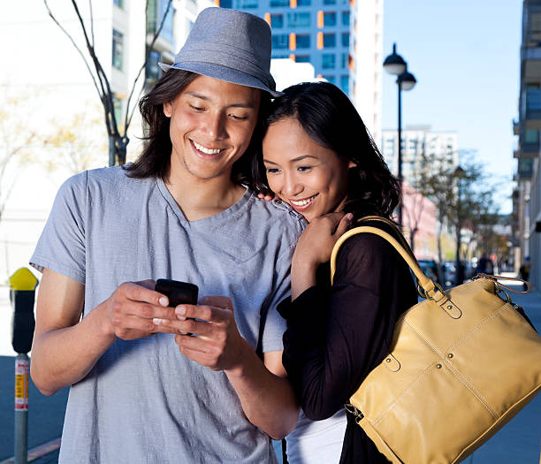 istock happy young couple on mobile phone 171271255
