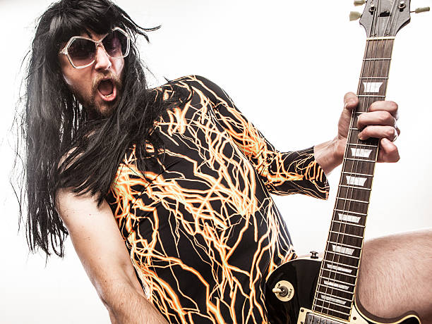 istock Posing Man in Black and Yellow Leotard Rocks With Guitar 171271268