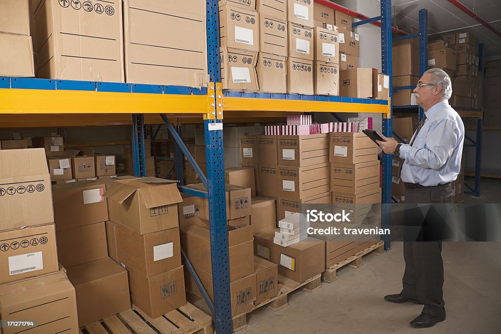 Cargo man checking on digital tablet  Adult Stock Photo