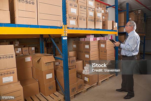 Cargo Man Checking On Digital Tablet Stock Photo - Download Image Now - Adult, Adults Only, Blue-collar Worker