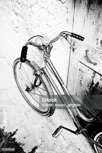 Bicycle Leaning Against Wall On Italian Street Stock Photo - Download Image Now - 1950-1959, 1960-1969, 1970-1979