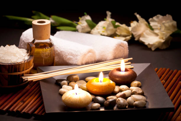 istock Aromatherapy candles in a row on a dark brown table 171272259