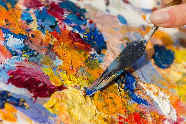 istock mixing oil paints with a brush 171272295