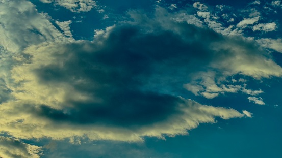 Beautiful dramatic sky at sunset with clouds.