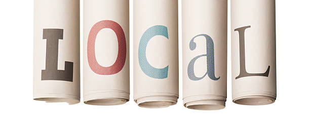 LOCAL news on rolled-up newspapers