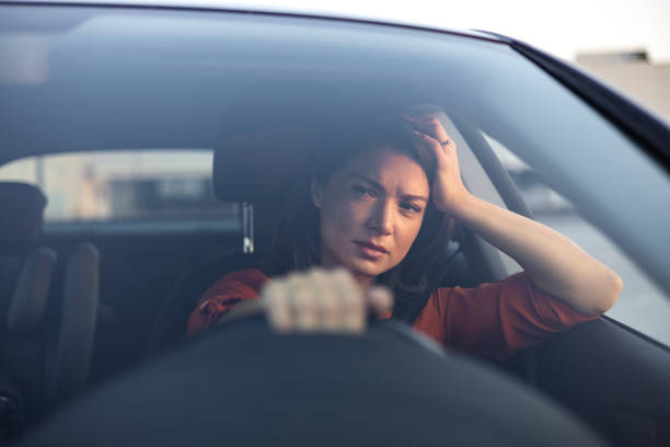 istock Depressed young woman driver sitting inside car, feeling doubtful confused about difficult decision suffering from personal psychological problem, burnout, quarrel break up with boyfriend, life crisis 1712735824