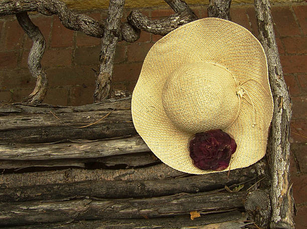 Hat on a garden bench stock photo