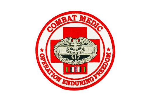 Isolated on white with clipping path.Patch worn by combat medics in Iraq (Operation Enduring Freedom).