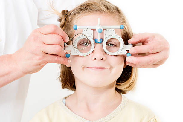 istock Young Girl Having Her Eyesight Checked Against White Background 171274699