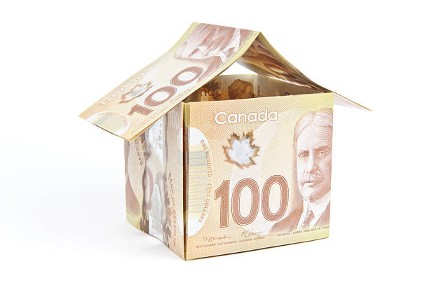 istock Canadian currency that had been folded to shape a house 171274869