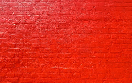 Bricks painted with a shiny red color.