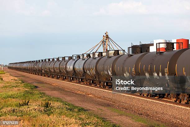 Moving Oil Pipeline Railroad Cars Passing Industrial Site Stock Photo - Download Image Now