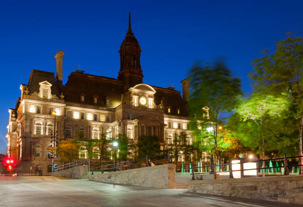 Montreal, Canada "The ornate town hall building illuminated in the evening in Montreal, Canada.See more images of Montreal:" place jacques cartier stock pictures, royalty-free photos & images