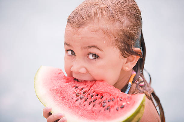 istock Little Girl Eating Watermelon 171276093