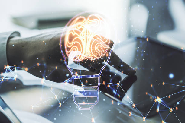 istock Double exposure of creative light bulb hologram with human brain and with finger clicks on a digital tablet on background, idea and brainstorming concept 1712764966