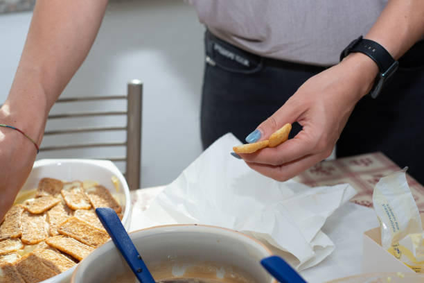 istock woman's hands prepares tiramisu. Typical Italian dessert 1712769514