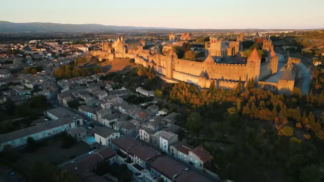 Aerial establishing shot of the medieval citadel and town surrounding Carcassonne, France