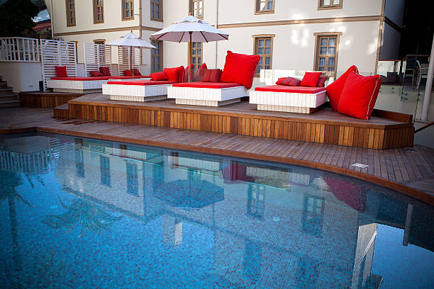 istock Red comfortable beds in a hotel's swimming-pool. 171277157