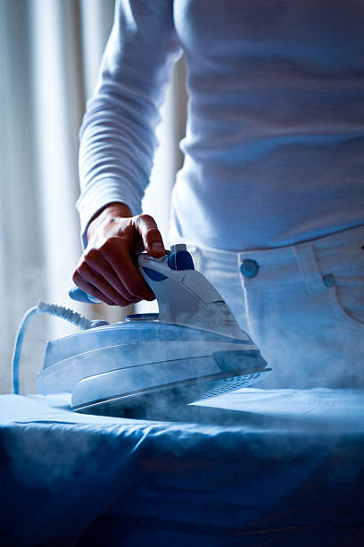 istock Woman ironing clothes 171277590